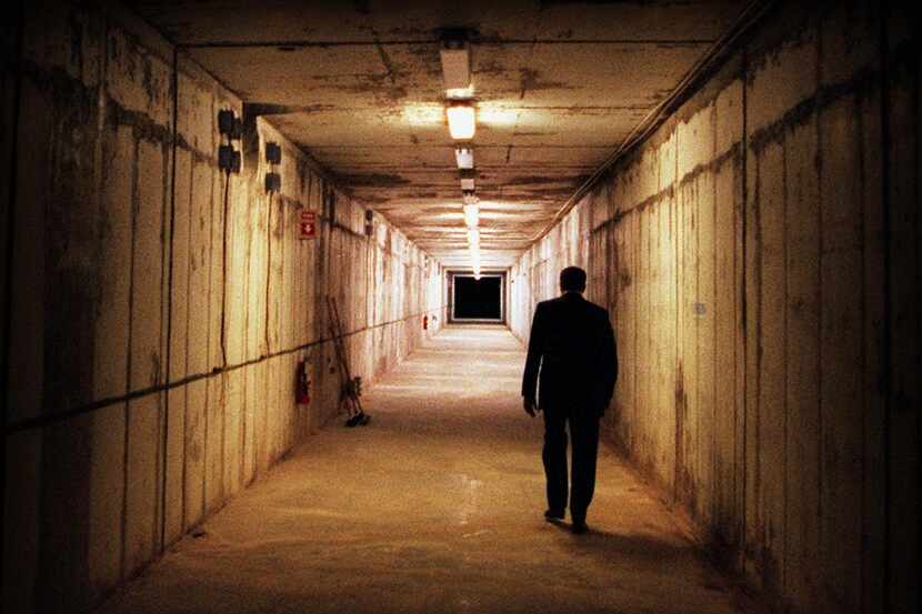 Texas General Land Office Facilities Manager J. Richard Fielder walks down the tunnel of the...