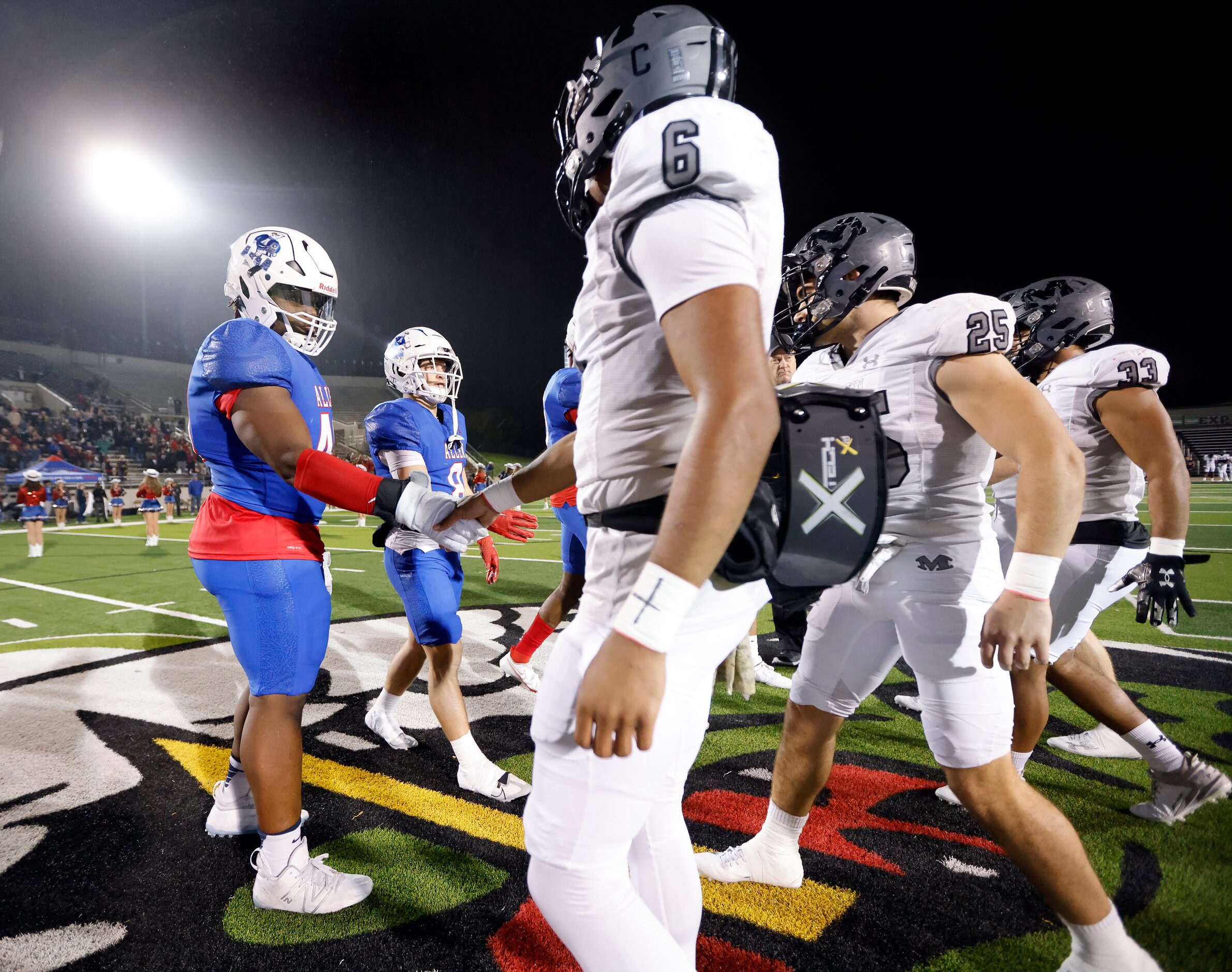 Allen defensive back Messiah Washington (4) and Arlington Martin’s Tristan Bittle (6) shake...