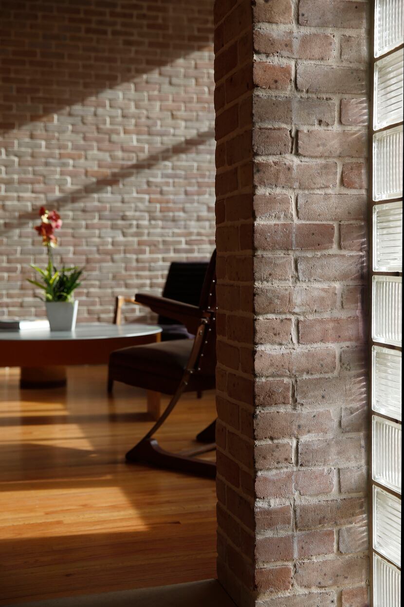 Glass brick allows diffused light into the entryway of the home. Thick, load bearing walls...