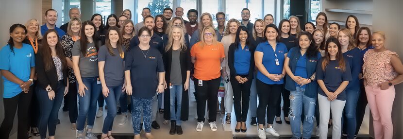 Catalyst Health Group's workers from its office in Plano posed for a group shot.