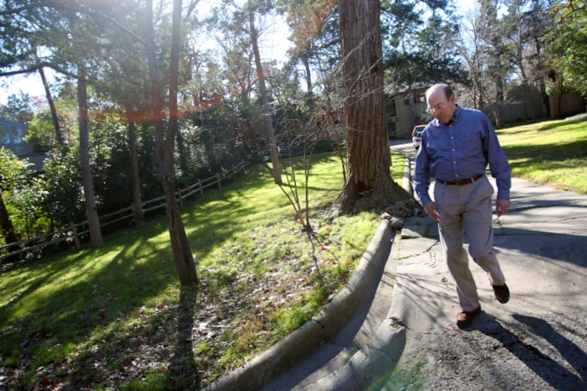Dr. Robert Haley walks down the drive of the home he lived in while in high school in Oak...