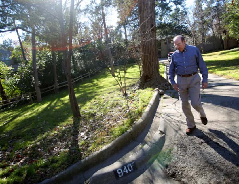 Dr. Robert Haley walks down the drive of the home he lived in while in high school in Oak...