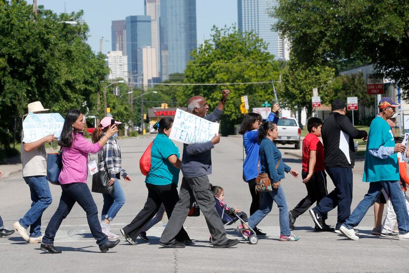 HMK Ltd. tenants of West Dallas march up Winnetka Avenue to protest the lack of a resolution...