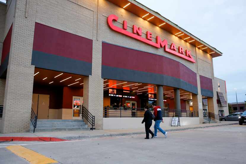 Moviegoers head into Cinemark at the corner of Coit Rd. and W. Park Blvd. in Plano on...