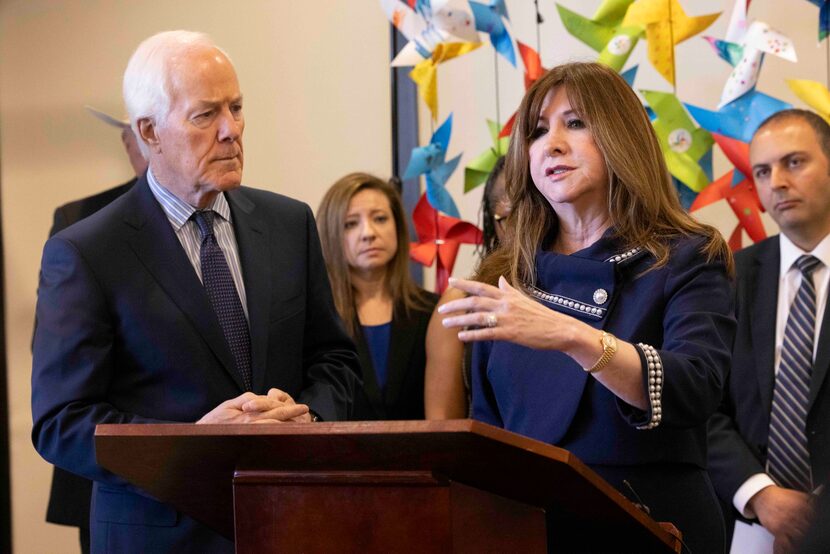 U.S. Sen. John Cornyn, R-Texas, listens as Dallas ISD Superintendent Stephanie Elizalde...