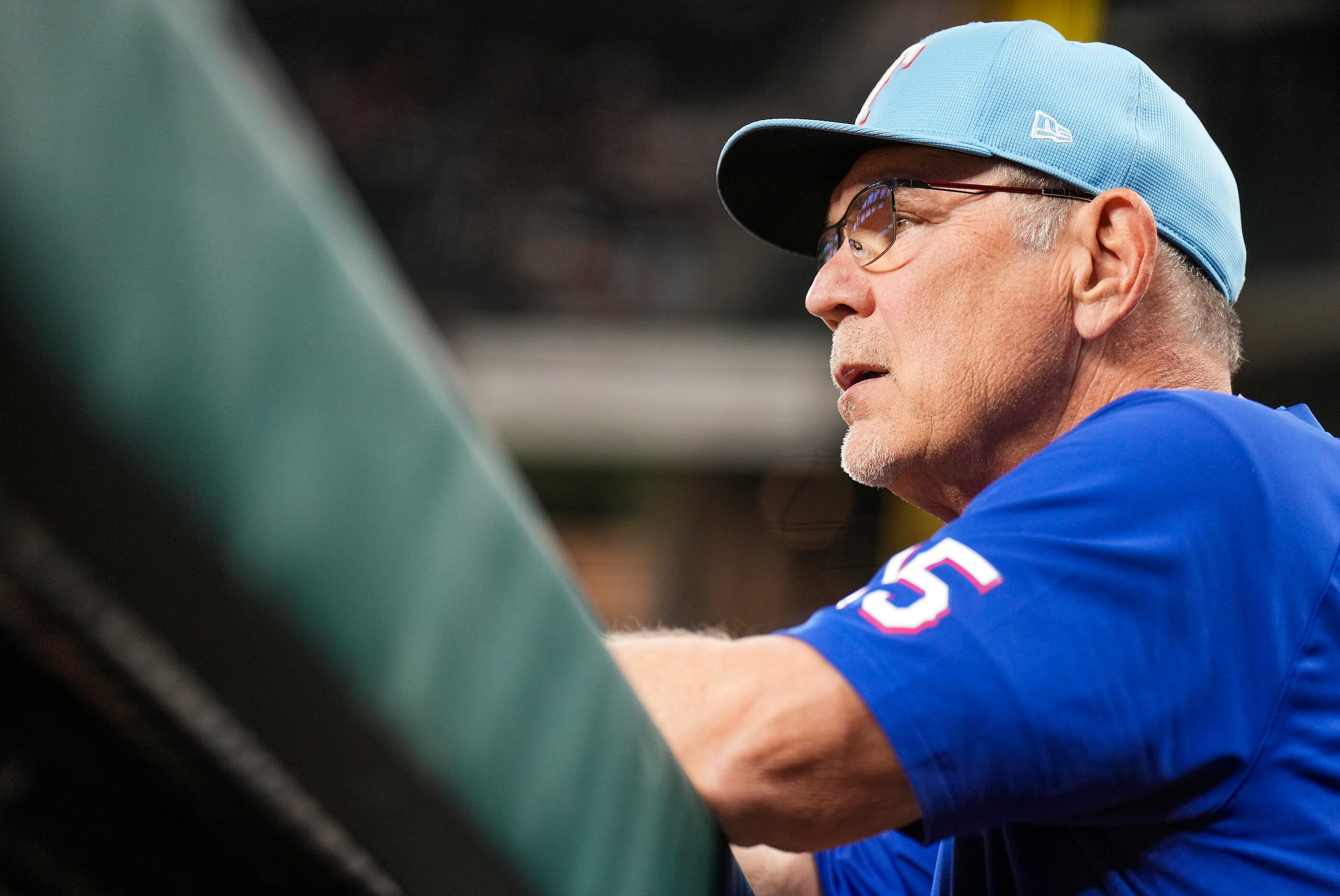 Texas Rangers manager Bruce Bochy watches from the dugout during the first inning of an...