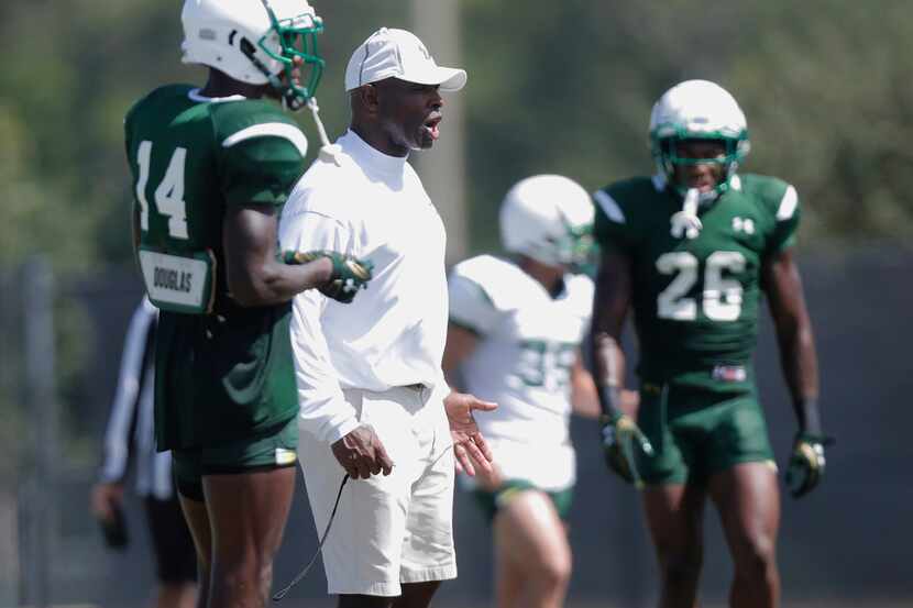 South Florida head football coach Charlie Strong watches practice in Tampa, Fla., Tuesday,...