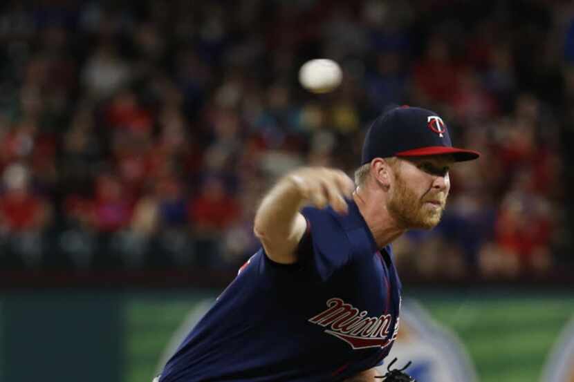 Minnesota Twins relief pitcher Michael Tonkin (59) throws in the eighth inning at Globe Life...