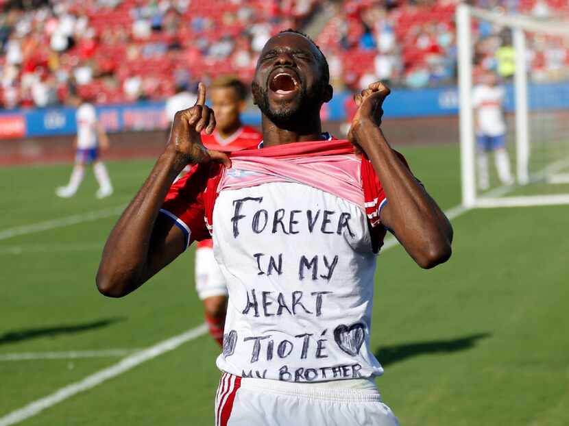 FC Dallas forward Roland Lamah (20) celebrates as he lifts his shirt with a message after...