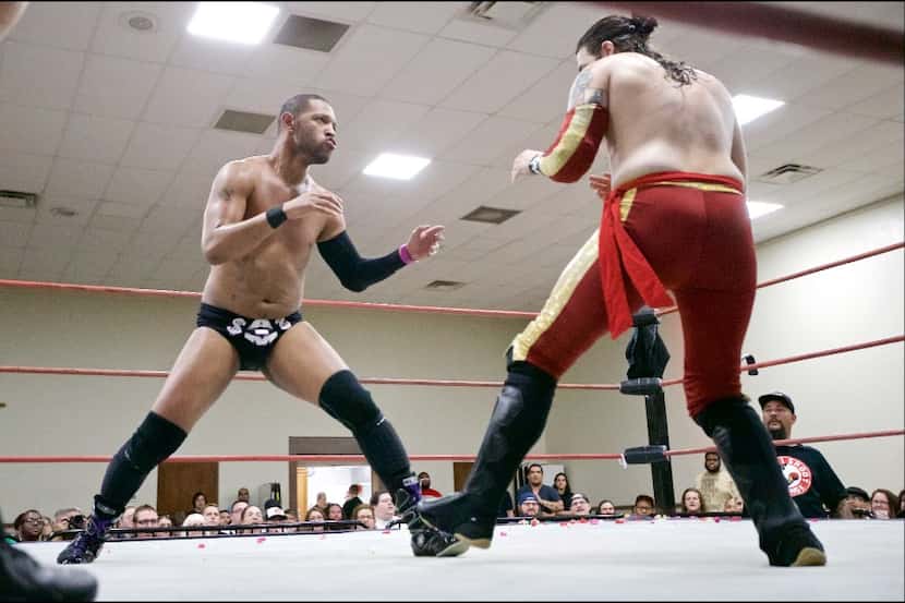Professional wrestlers Jerome Daniels, left, and Davey Vega square off during a VIP...