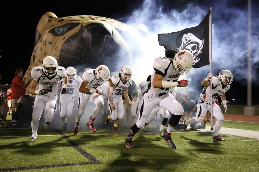 Lovejoy players enter the field before a high school football game between Lovejoy and Wylie...