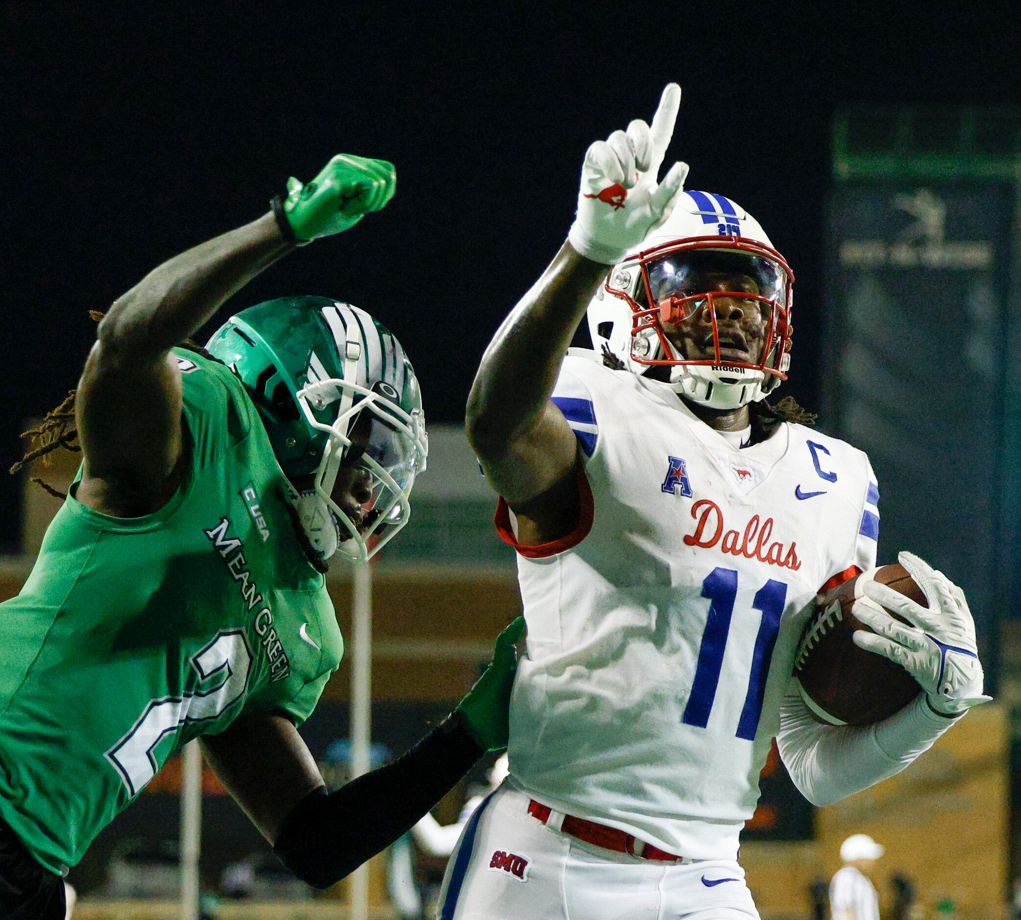 SMU wide receiver Rashee Rice (11) celebrates a touchdown catch in the end zone ahead of UNT...