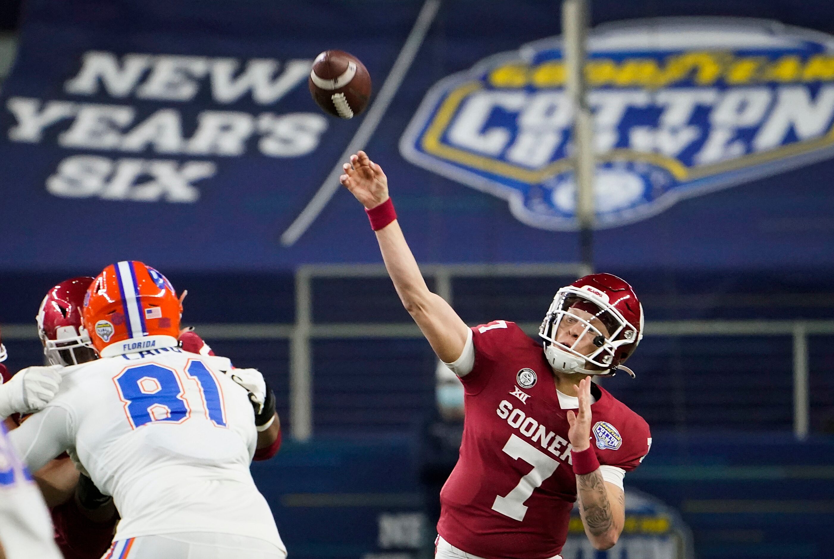 Oklahoma quarterback Spencer Rattler (7) throws a pass over Florida defensive lineman Dante...