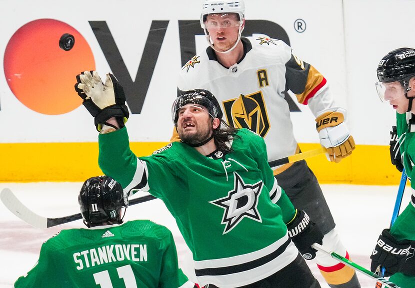 Dallas Stars defenseman Chris Tanev (3) knocks a high puck out of the air during the third...