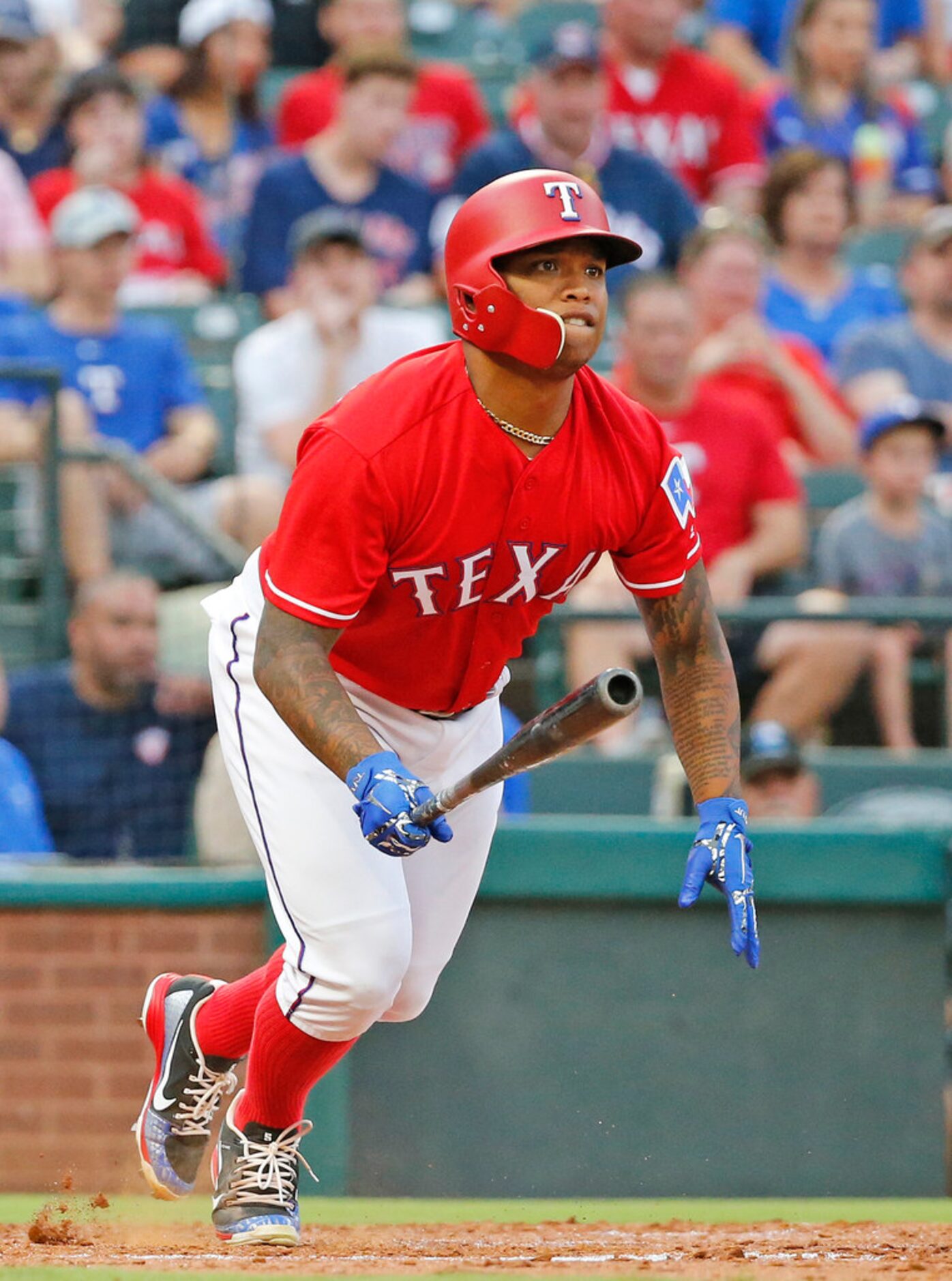 Texas Rangers designated hitter Willie Calhoun (5) singles in a run in the second inning...