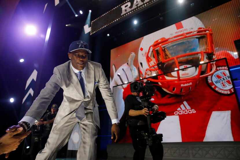 Nebraska defensive lineman Randy Gregory celebrates after being selected by the Dallas...