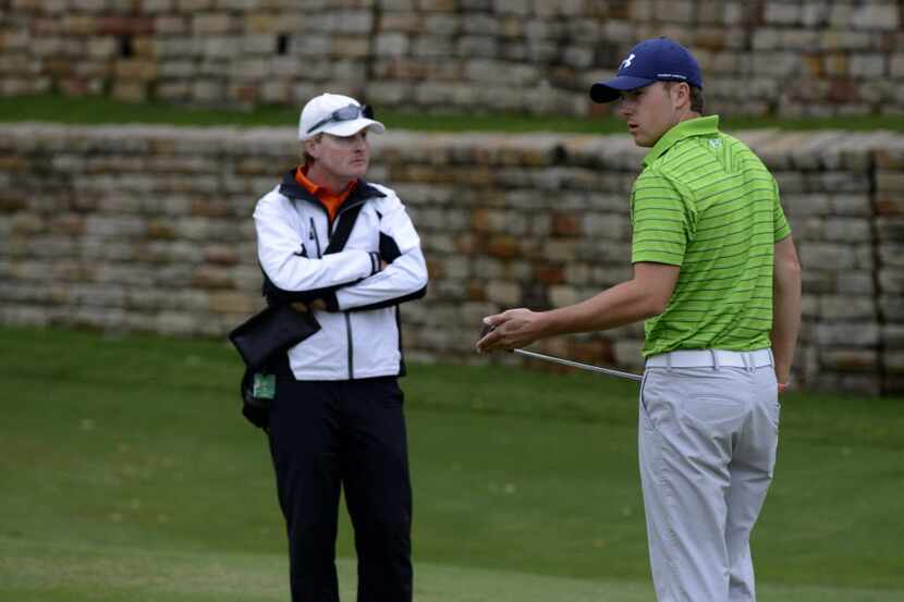 Jordan Spieth warms up with coach Cameron McCormick before teeing off at the Byron Nelson...