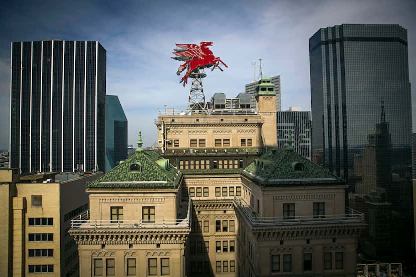 The landmark Magnolia Building is best known for its rooftop flying red horse sign.