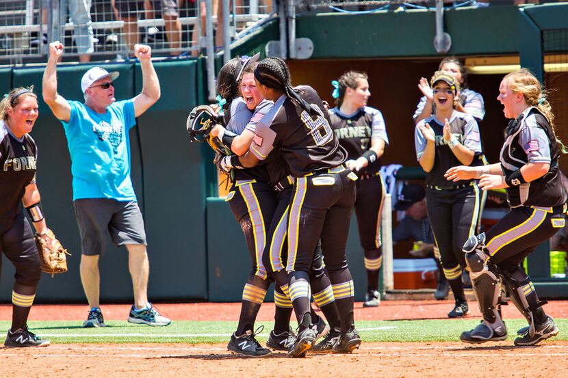 Forney sophomore pitcher Savanna DesRochers (center) celebrates with her team after they...