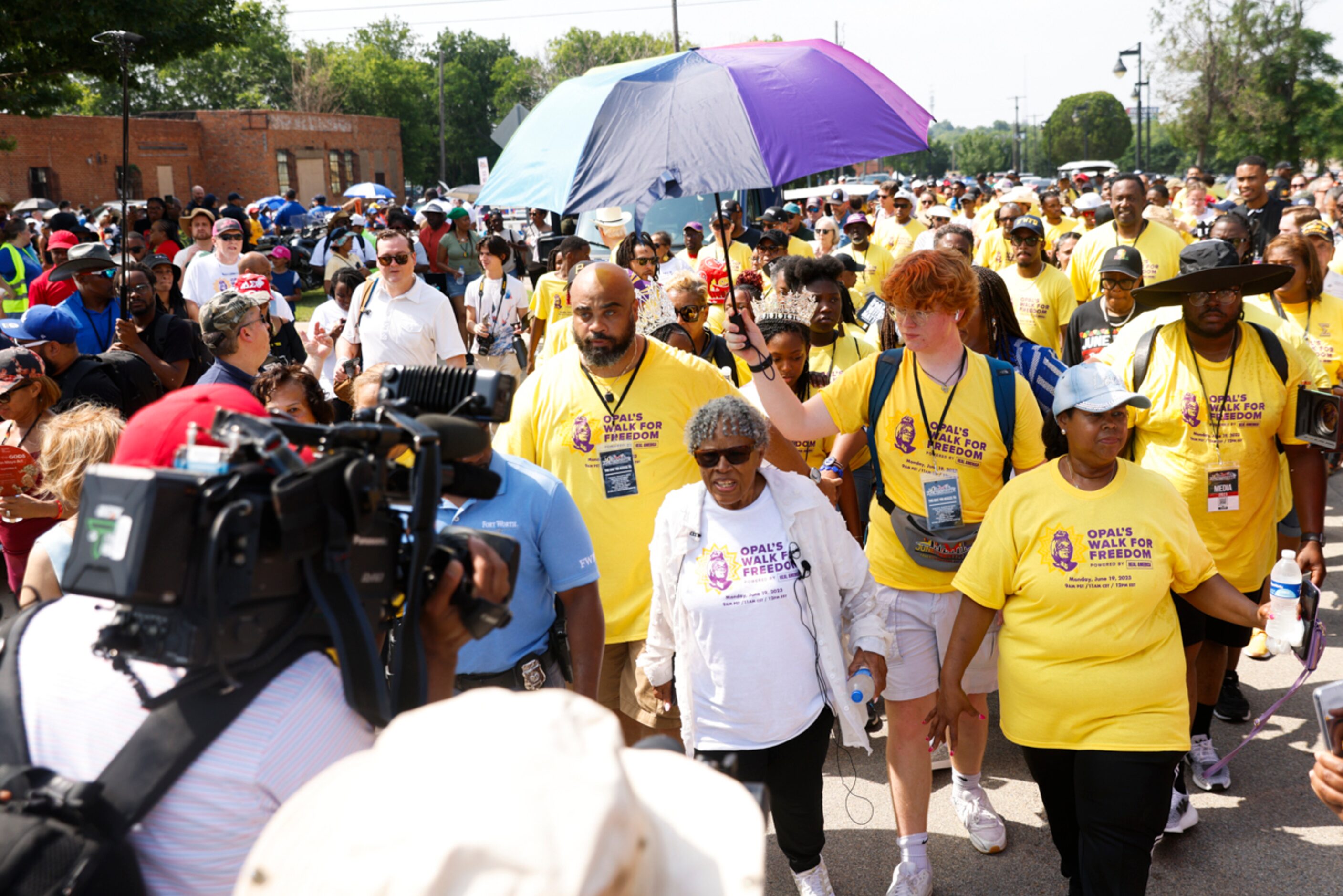 Surrounded by crowd and media members, Grandmother of Juneteenth, Opal Lee, starts off...