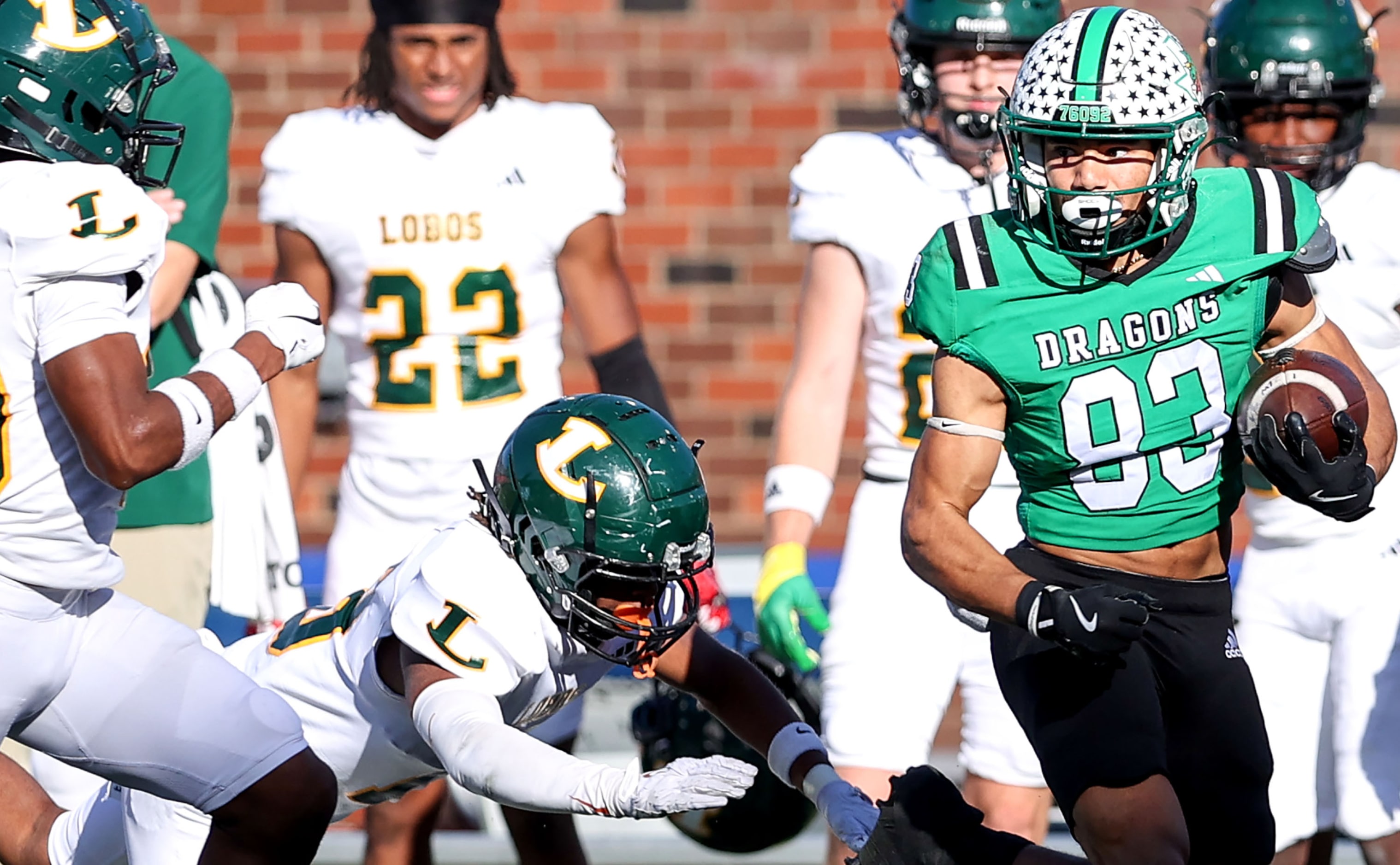 Southlake Carroll running back Christian Glenn (83) gets past Longview defensive back...