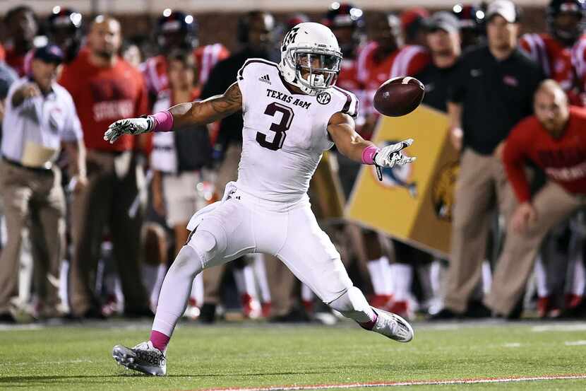 OXFORD, MS - OCTOBER 24:  Christian Kirk #3 of the Texas A&M Aggies reaches for a pass...