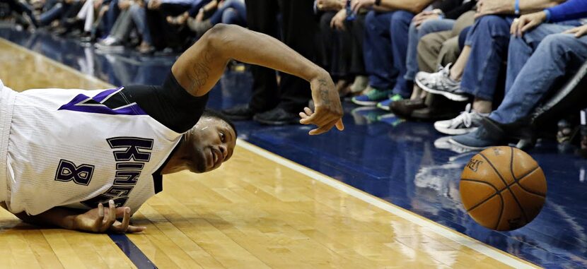 Sacramento Kings forward Rudy Gay tries to keep the ball from going out of bands during the...