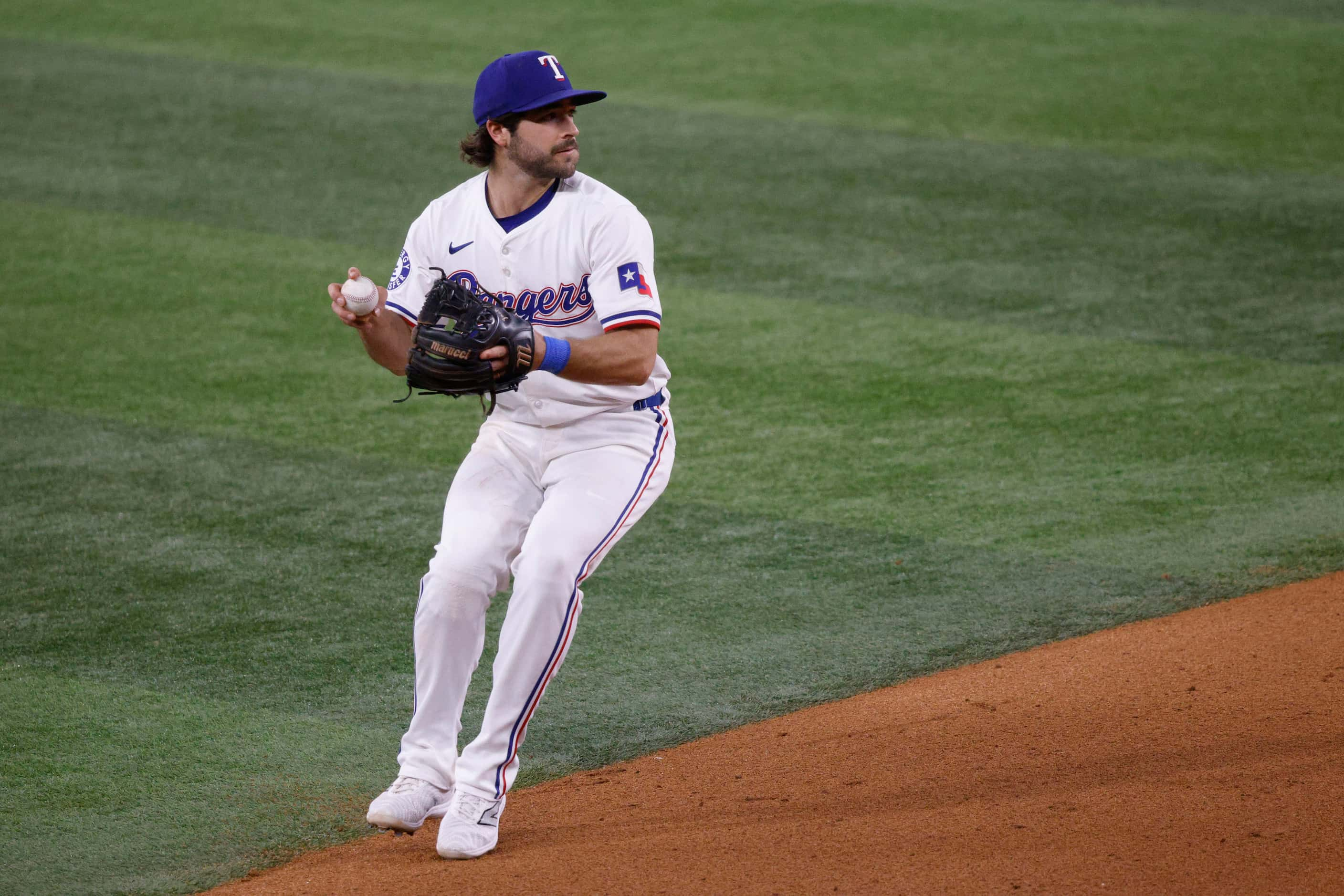 Texas Rangers shortstop Josh Smith (8) throws a ball to the first during the eighth inning...