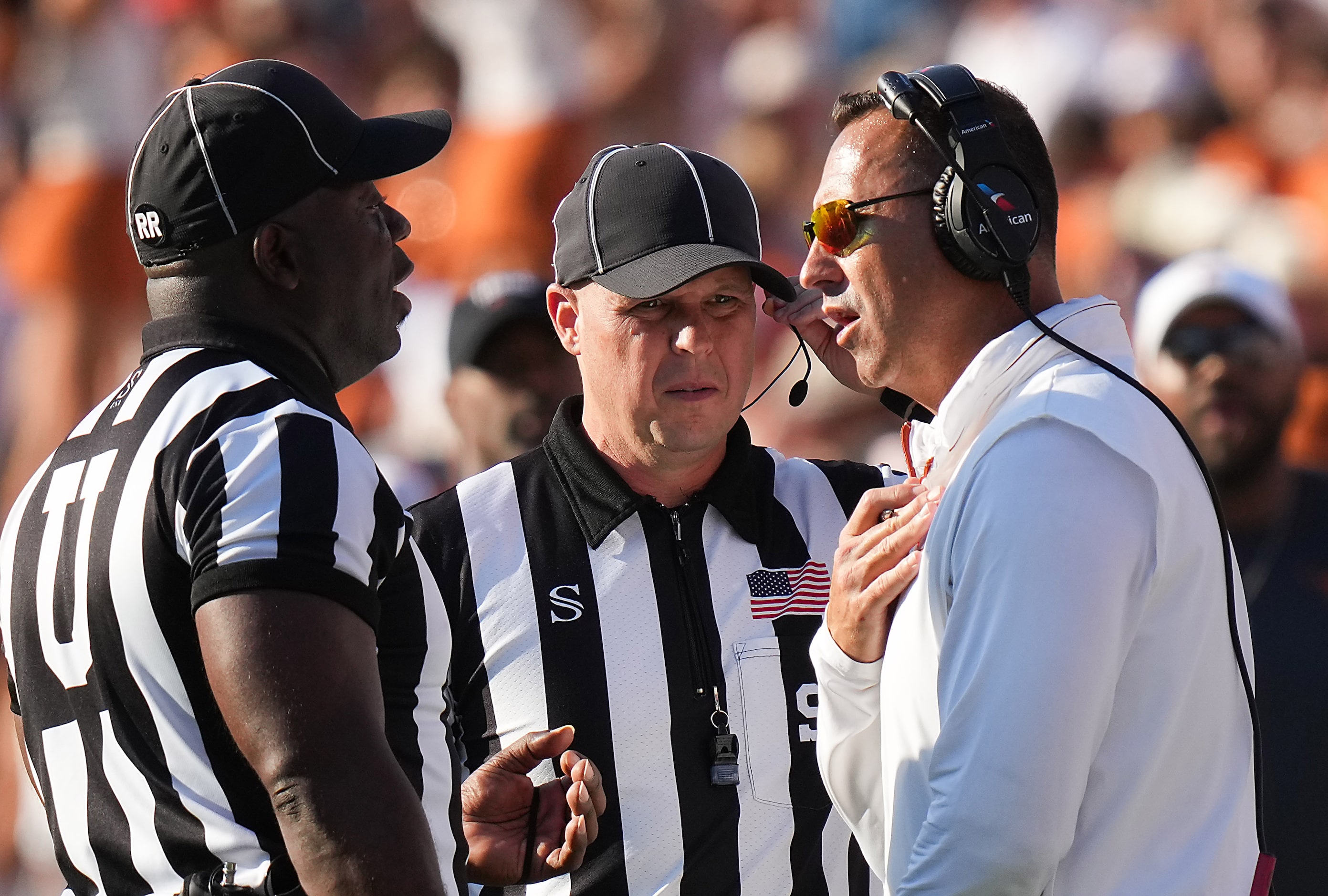 Texas head coach Steve Sarkisian talks to officials during the second half of an NCAA...