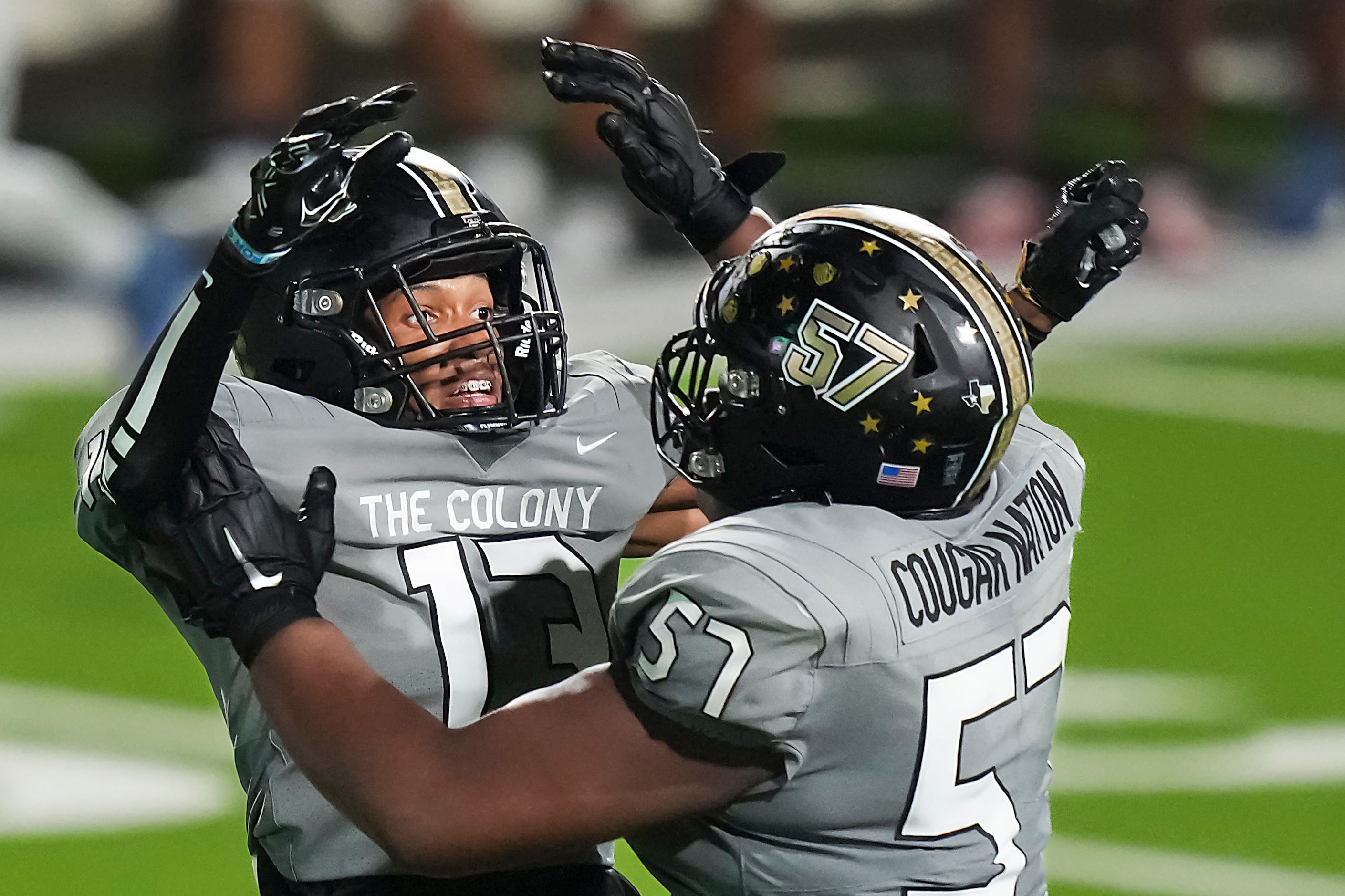 The Colony’s Kingston Jones (13) celebrates with Richard McCullough (57) after Denton Ryan...