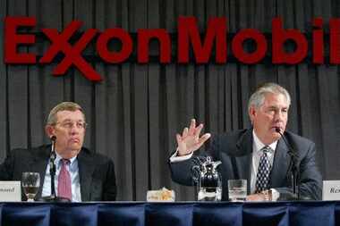 Exxon Mobil CEO Rex W. Tillerson, right, and former chairman and CEO Lee R. Raymond. 