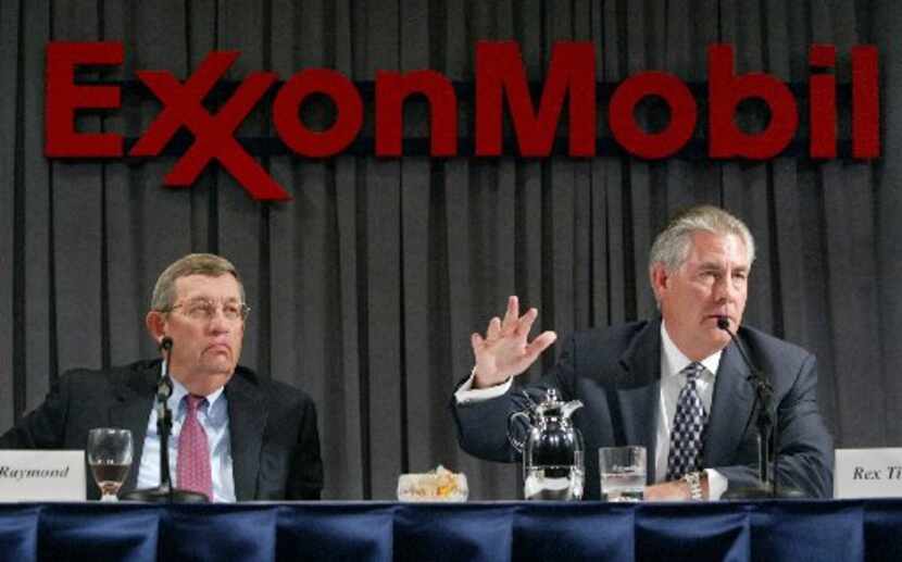 Former Exxon Mobil CEOs Rex W. Tillerson, right, and Lee R. Raymond. 