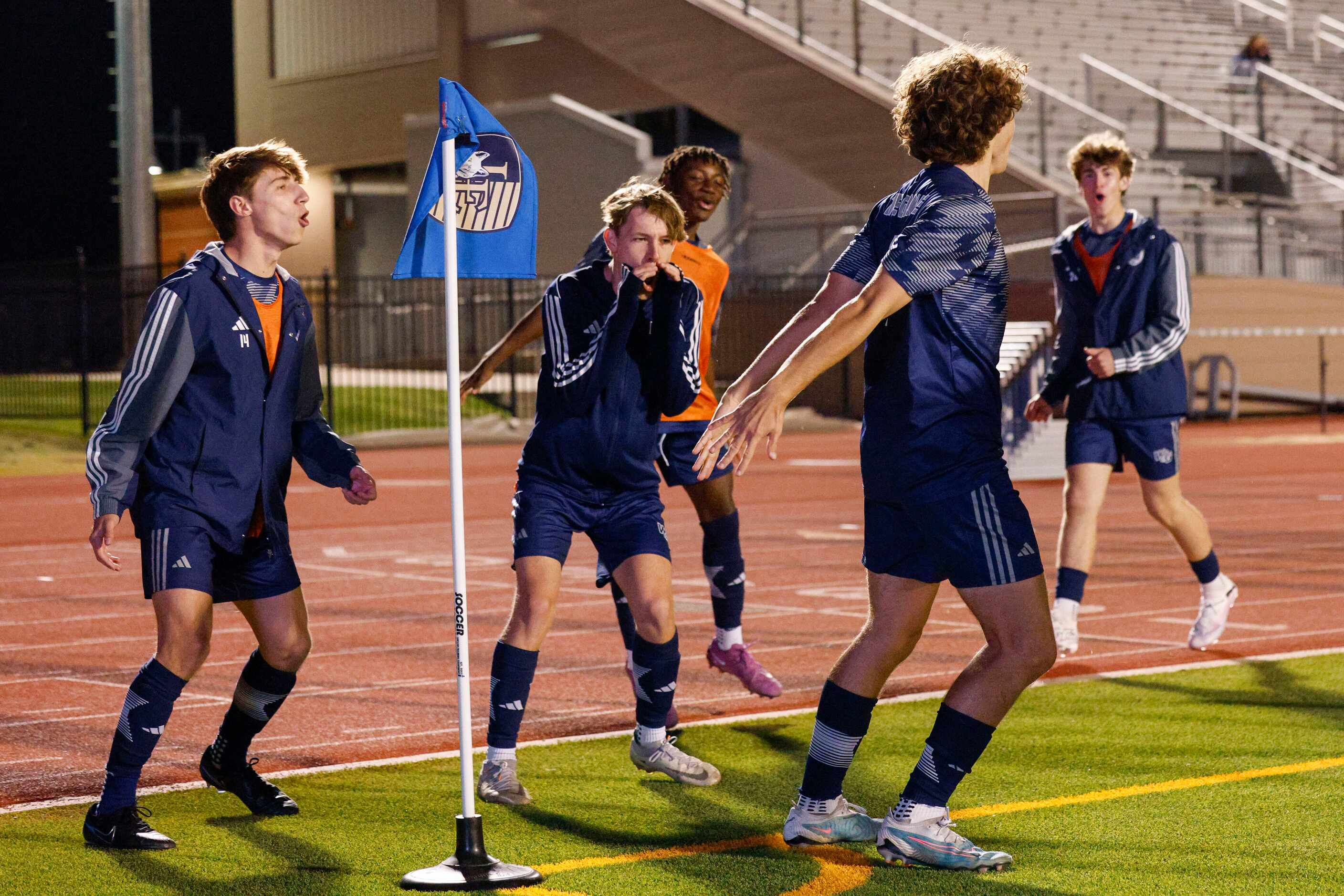 Prosper Walnut Grove midfielder Benjamin Joyner (7) center throws his arms back as he...