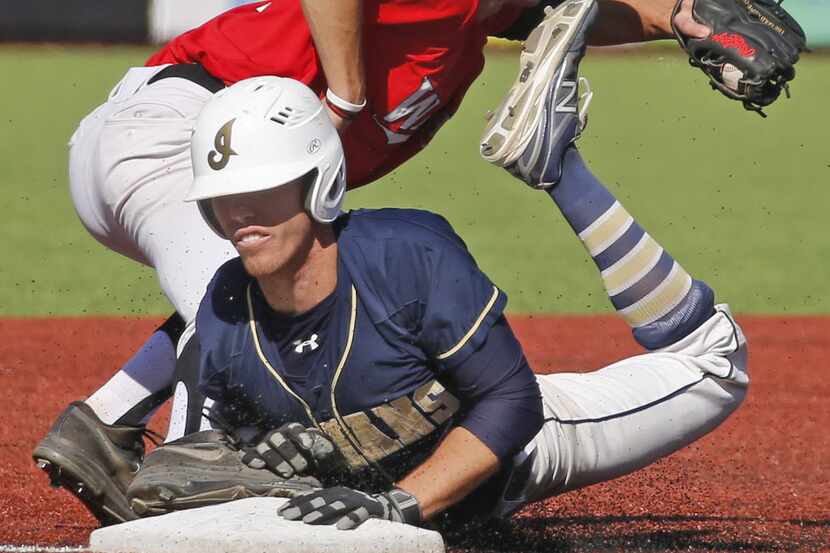 Keller runner Peyton Grassanovits tries to beat the throw to third base but is ruled out as...