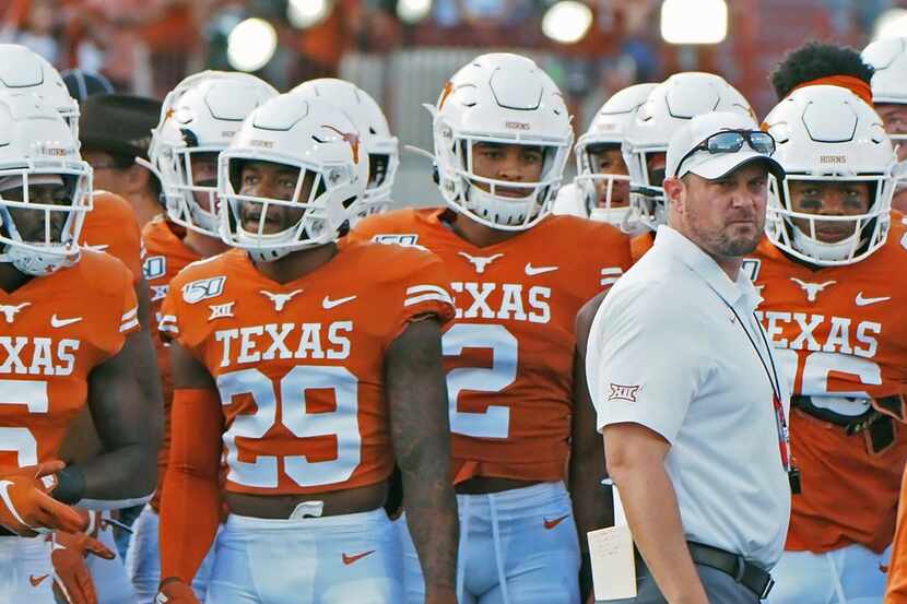 Texas head coach Tom Herman waits with his team before the start of an NCAA college football...