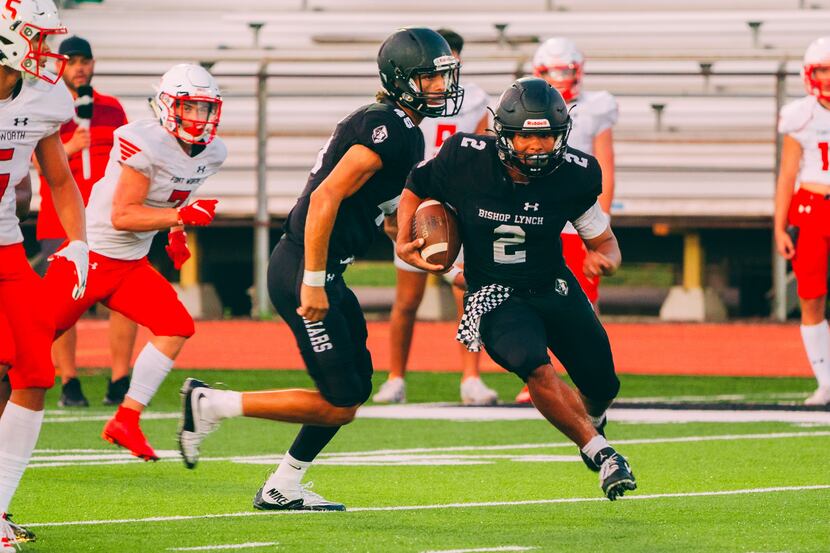 Bishop Lynch running back Isaiah Schmidtke (No. 2) rushed for 340 yards and four touchdowns,...