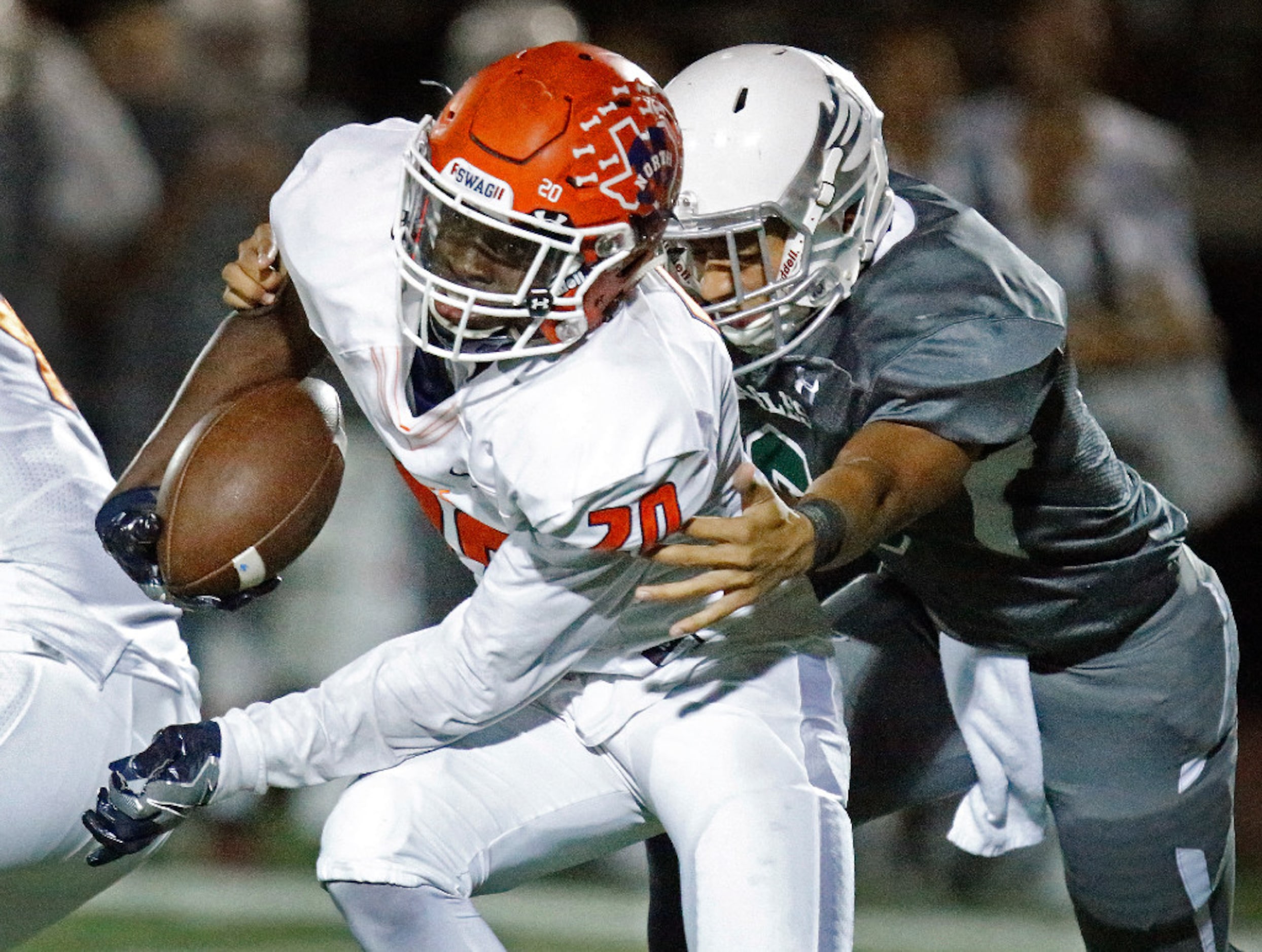 Prosper High School defensive back Jayden Ford (3) tries to stop McKinney North High School...