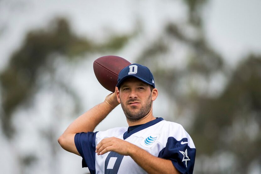 Dallas Cowboys quarterback Tony Romo throws a pass during the morning walkthrough on the...