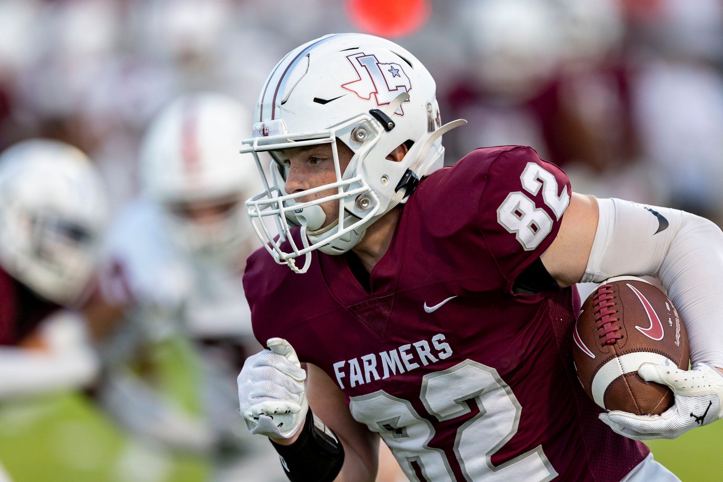 Lewisville senior tight end Lucas Sanders (82) carries the ball during the first half of a...