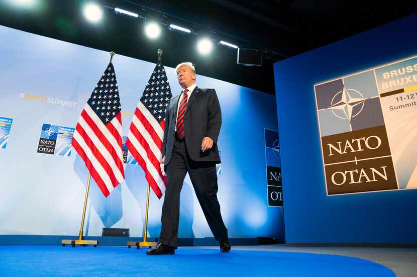 President Donald Trump arrives at a news conference following the NATO summit in Brussels on...