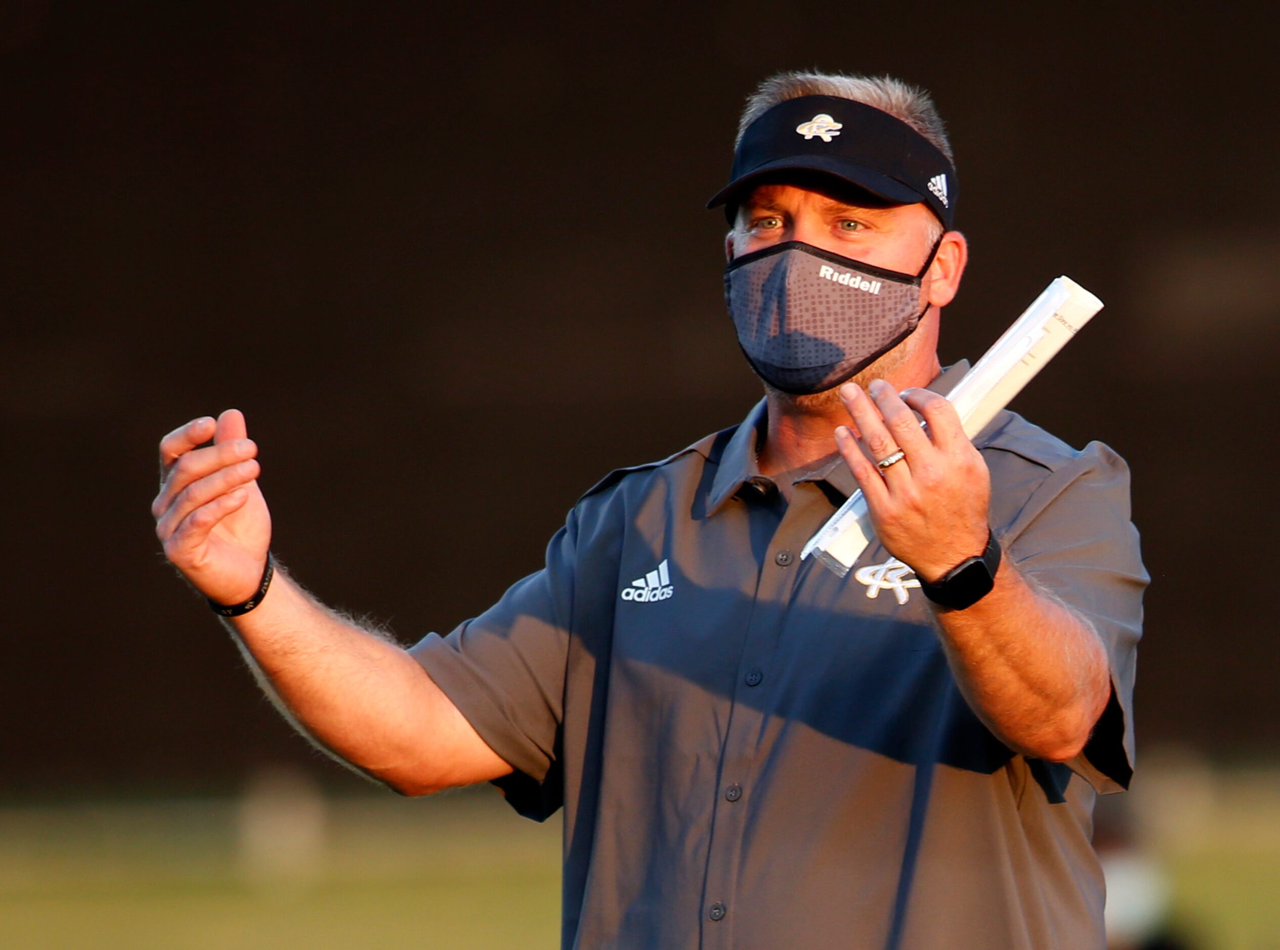 Royse City head coach David Petroff directs his players during team warm-up drills prior to...