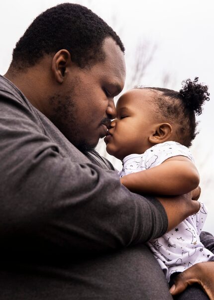 Kerry Parks shares a kiss with his 15-month-old daughter, Kaysen. The family is relocating...