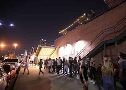 People gather outside Bottled Blonde's Backyard entrance in Deep Ellum on Aug. 28, 2020.