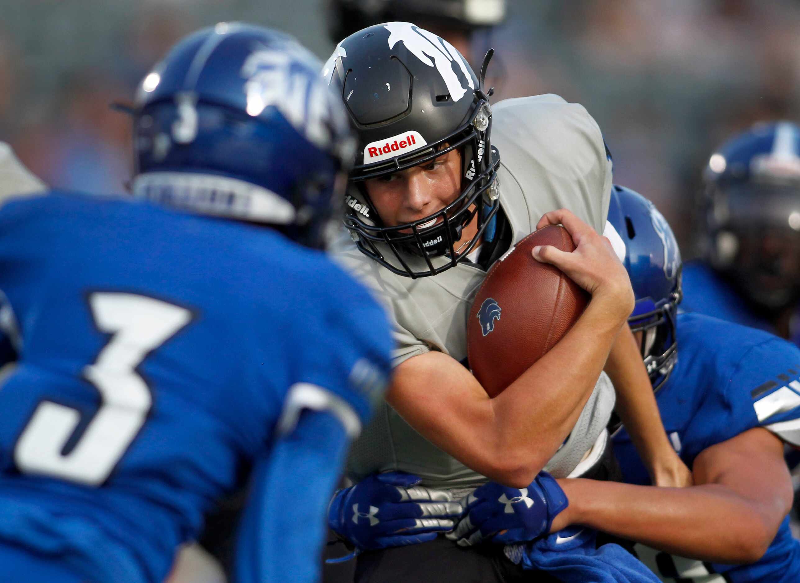 Plano West quarterback Andrew Pokorny (16) eyes the end zone on a quarterback keeper as...