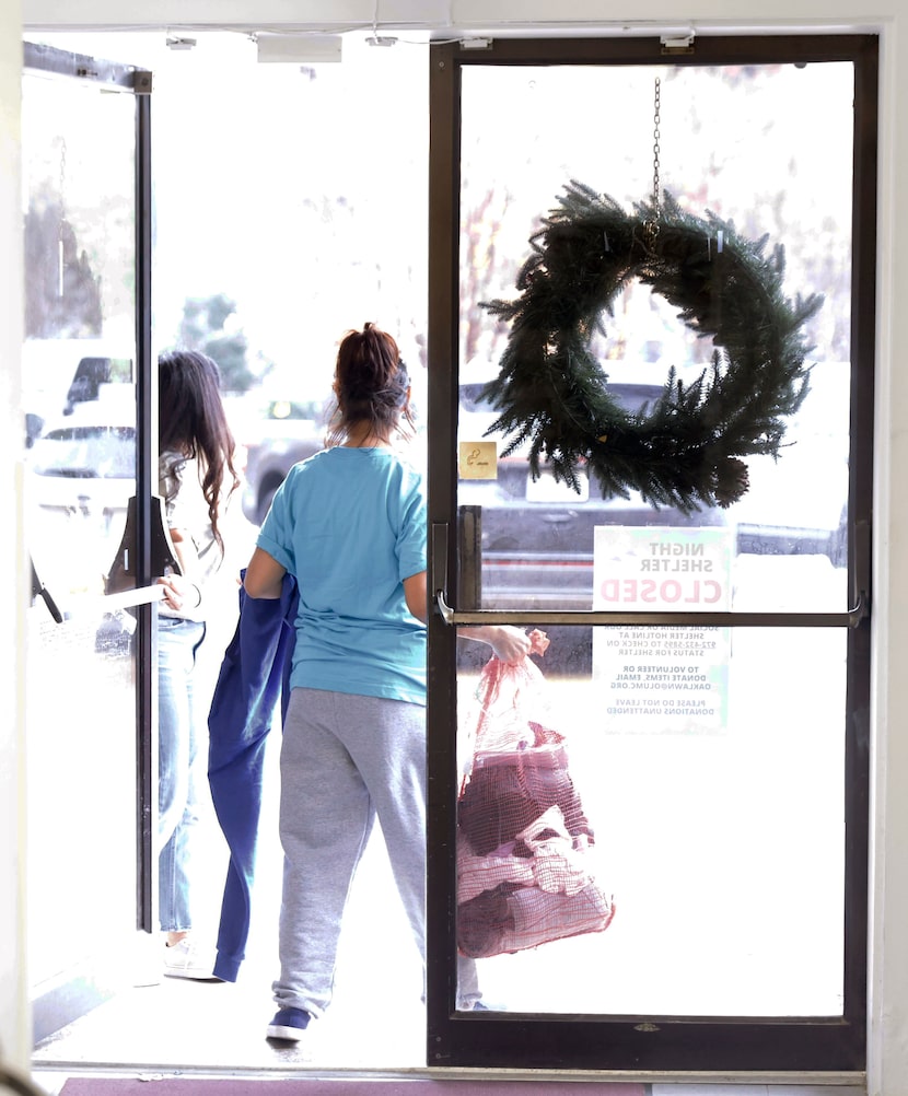 A Colombian migrant leaves the Oak Lawn United Methodist Church in Dallas December 7, 2022...