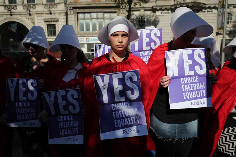 Volunteers from Reproductive rights, against Oppression, Sexism & Austerity (ROSA) dressed...