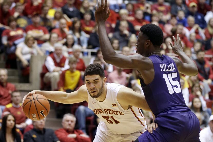 Iowa State forward Georges Niang, left, drives past TCU forward JD Miller, right, during the...