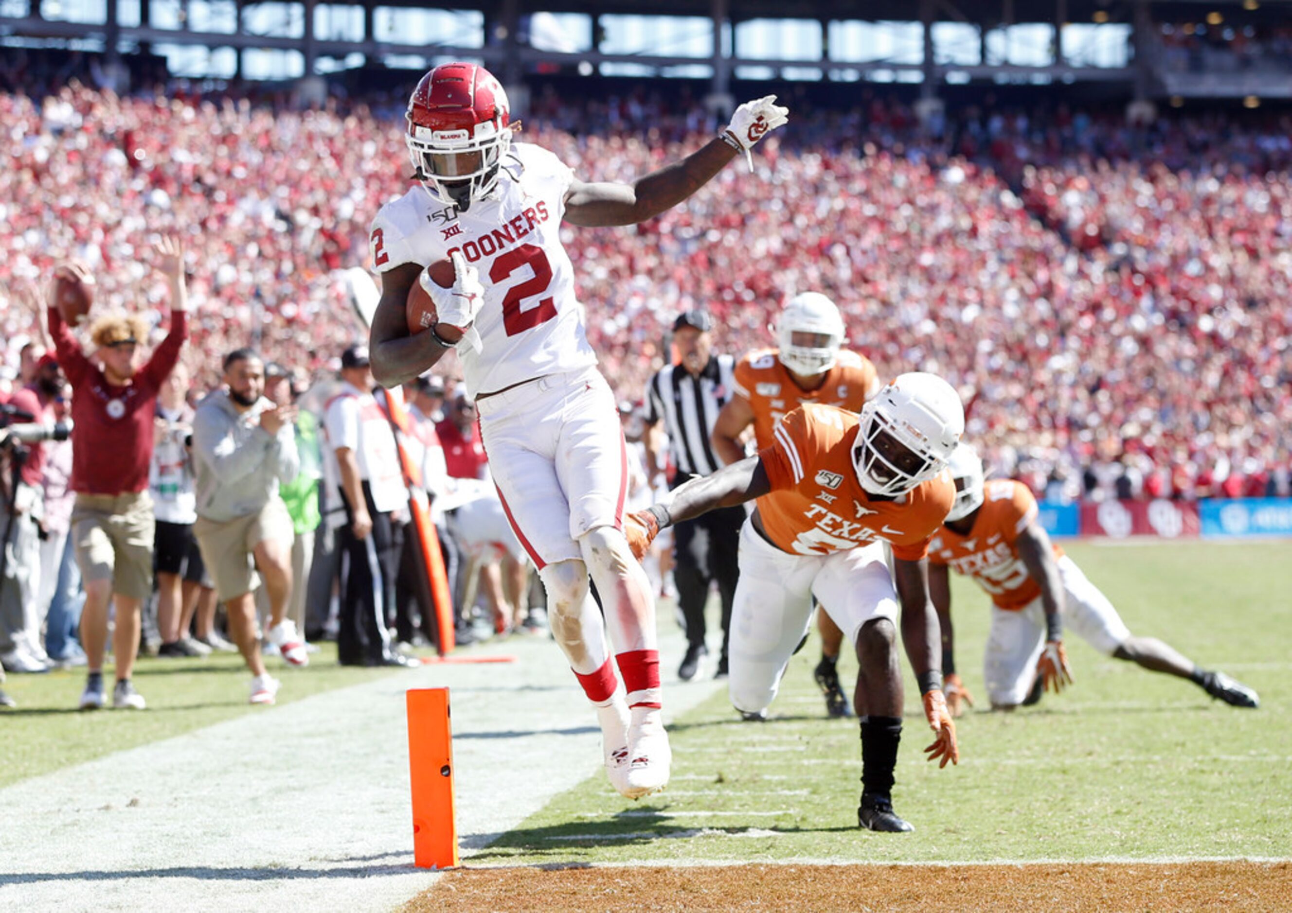 Oklahoma Sooners wide receiver CeeDee Lamb (2) scores a touchdown after passing Texas...