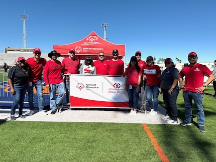 Special Olympics Texas athletes pose with CCSWB volunteers at a Special Olympics event.