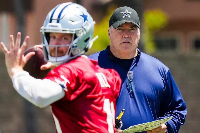 Dallas Cowboys head coach Mike McCarthy looks on as quarterback Cooper Rush (10) throws a...